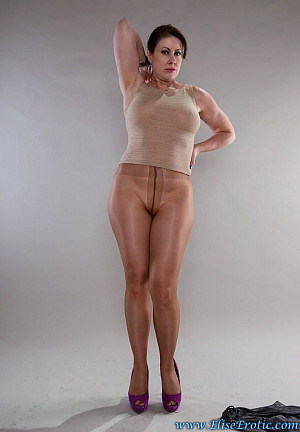 Redhead MILF Elise in sheer tan blouse and glossy platino cleancut tights takes off her skirt