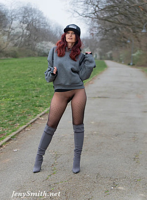 Jeny walks outdoors without a skirt, wearing only seamless dot patterned pantyhose to cover her legs.